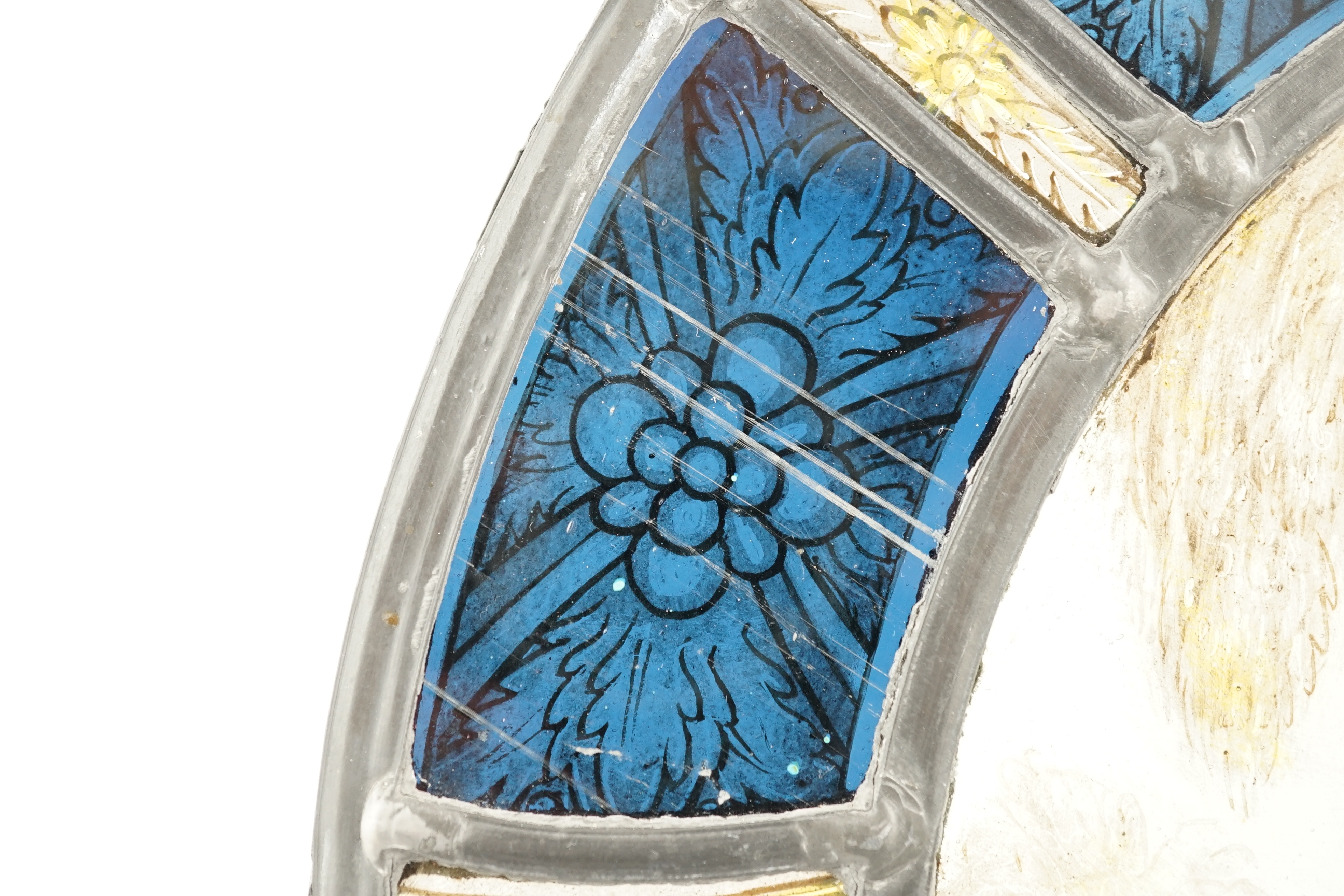 An 18th century Flemish stained glass panel, 32cm diameter